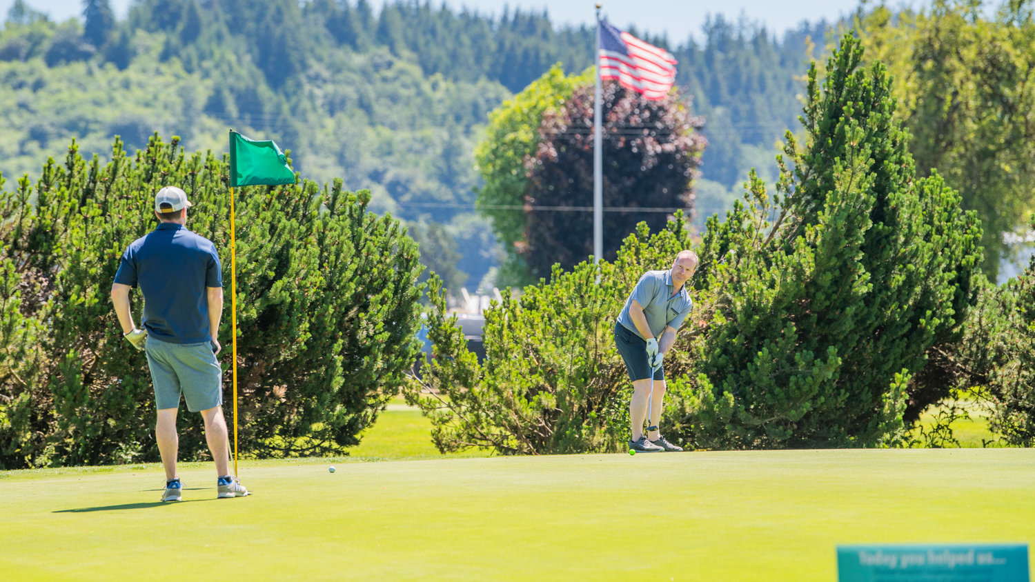 Chad Taylor attempts a put Friday, during a charity tournament raising money for the Hope Alliance, at Riverside Golf Course in Chehalis.
